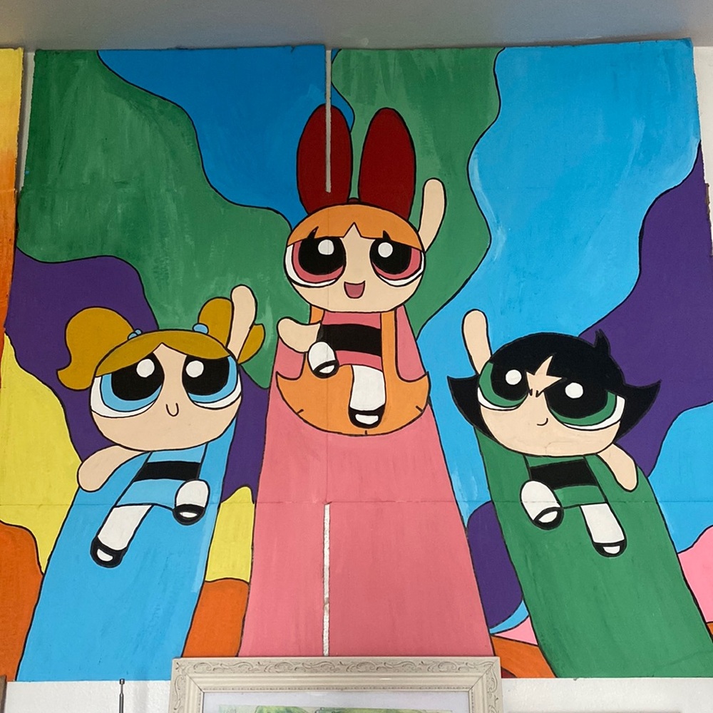 Power pull girl painting on cardboard